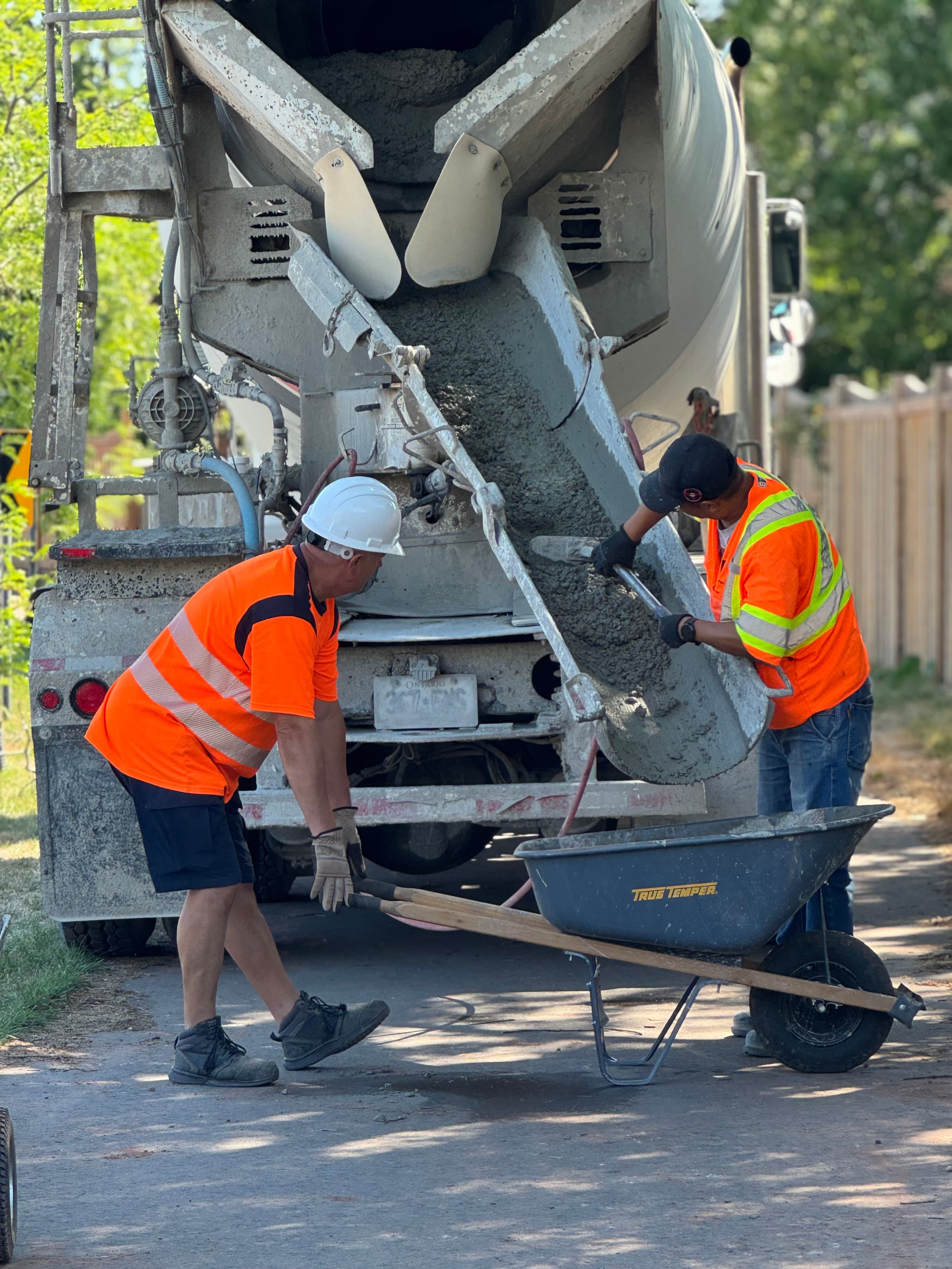 Lush residential landscaping with gardens and stone pathways