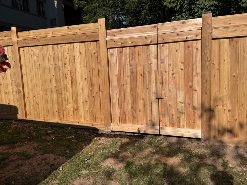 Wood fence with wide gate